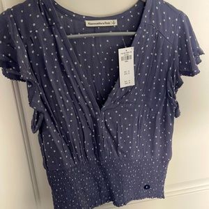 Short sleeve shirt/blouse. Size small, never worn.